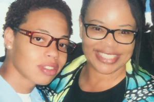 Two African-American staring at the camera.