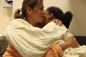 A mother hugs her daughter in a psychiatric hospital
