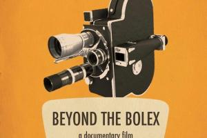 Bolex Camera against an orange backdrop