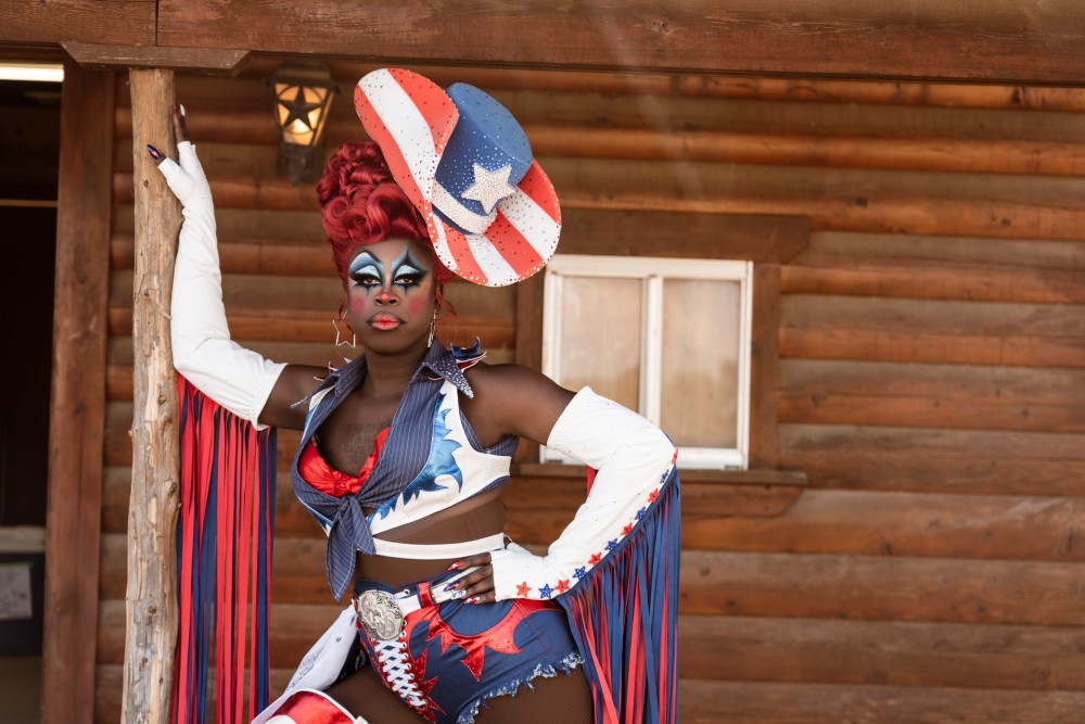 Bob the Drag Queen poses in drag, dressed in a red, white and blue cowgirl outfit. From “We’re Here.” Photo courtesy of Greg Endries/HBO.