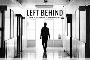 A silhouetted student walks through the hallways of this public high school.