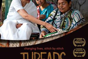 Surayia Rahman instructs a young Bengali woman as she works on her stitch-work. 