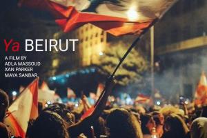 a protestor waves the red and white striped flag of Beirut over a sea of other protestors at night.