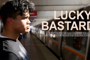 A young boy stands before an arriving subway train.