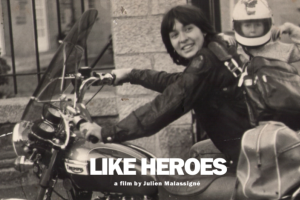 A black and white photograph of a woman and a child on a motorcycle.