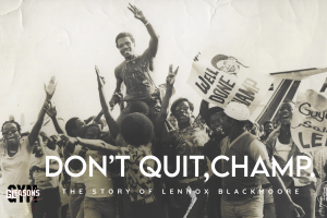 A black and white image of a Black man being carried by a group of people in celebration, with signs reading "well done, champ"