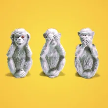 An illustration of the see no evil, hear no evil, and speak no evil monkeys against a yellow background.