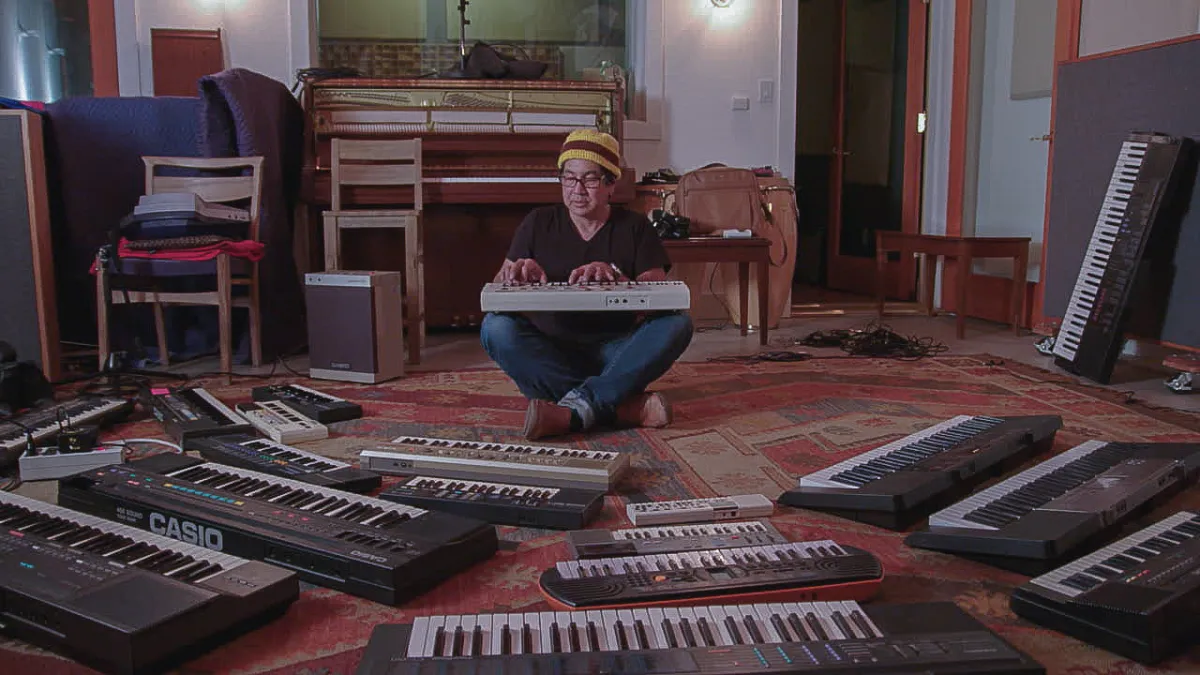 Musician Money Mark formerly of the Beasty Boys sits surrounded by various casios he uses to make his music.